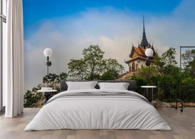 Beautiful white buddhist pavilion on the hilltop with blue sky background at Wat Phraputthachai temple, Saraburi, Thailand. This temple is public for entry and tourist can enjoy the 360-degree view. Wall mural