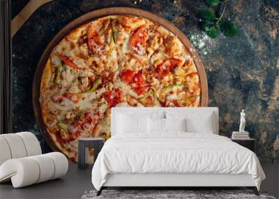 Chicken pizza with bell peppers, tomato, cheese on round wooden board Wall mural