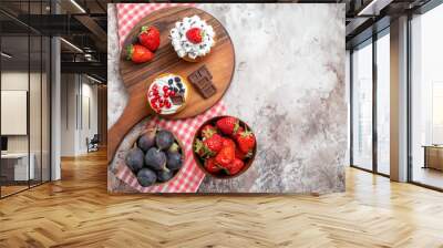 top view delicious cakes with fresh fruits on light background biscuit sweet cake dessert color free place Wall mural