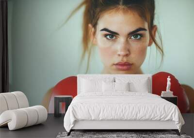 Determined woman practicing boxing in a gym, focus on goals, motivational environment, action shot Wall mural