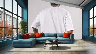 African american man in a hat and white t-shirt. Wall mural