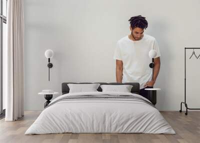 African american man wearing white blank t-shirt. Mock-up. Wall mural