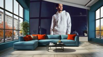 Attractive african american man in hoodie sweater. Mock-up. Wall mural