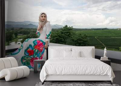 Arab women on the mountain view background. Wall mural