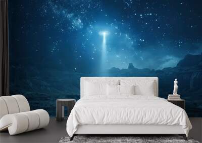 A remote desert landscape under a starry night sky, with a mysterious UFO descending towards the ground, illuminating the area with its bright lights. Wall mural