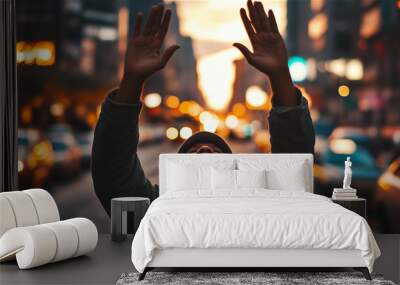 a person who prays with his hands up in the city Wall mural