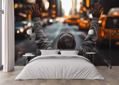 a person who prays with his hands up in the city Wall mural