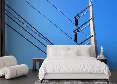 High voltage on the pole On the blue sky background With copy space Wall mural