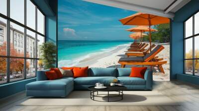 Idyllic beach scene with wooden lounge chairs and umbrellas, crystal-clear turquoise water, and a serene tropical island setting under blue skies. Wall mural