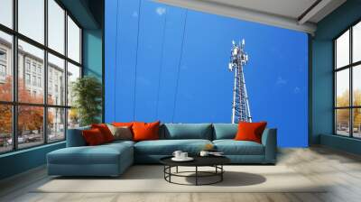 Telecommunication tower and high voltage cables With wireless communication technology equipment for the telecommunications industry, mobile networks On a background with white clouds With copy space Wall mural