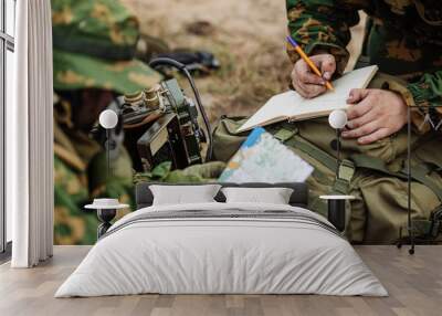 radio operator taking notes and radio Wall mural