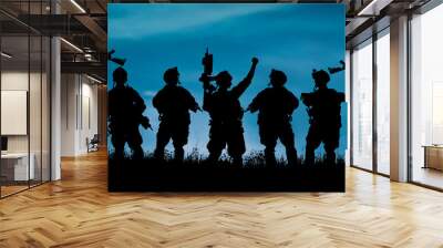 Silhouette of military team soldiers or officers with weapons Wall mural