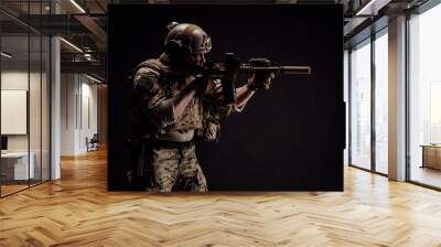 Special forces United States soldier or private military contractor holding rifle. Image on a black background. war, army and people concept Wall mural