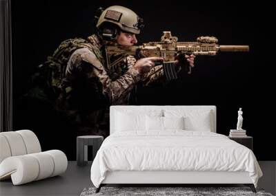 Special forces United States soldier or private military contractor holding rifle. Image on a black background. Wall mural