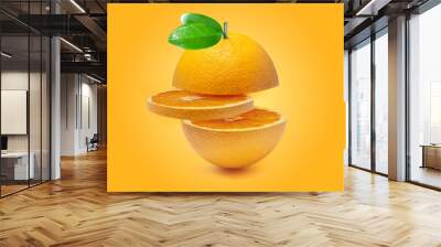 Orange isolated on orange background.Juicy and sweet and renowned for its concentration of vitamin C Wall mural