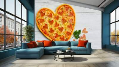 Heart shaped pizza with heart shaped salami on  white wood background.Creative art food idea for Valentine or Mother day.Top view.Copy space Wall mural