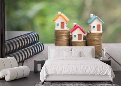 Mini house model and stack of coins. Business growth.  Property investment and house mortgage financial real estate concept Wall mural