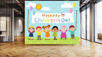 Happy kids holding Children’s Day banner. Wall mural