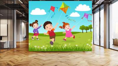 Three kids flying kites in the park Wall mural