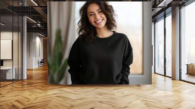 Attractive Girl wearing blank black sweater shirt mockup, Beautiful woman wearing blank Gildan 18000 casual sweater shirt mockup. Wall mural