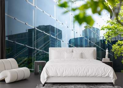 Green tree and glass office building, Eco-friendly building in modern city. Wall mural