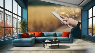 Hand of farmer touch on tablet screen Wall mural