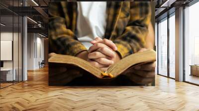 Little boy and his father praying and read Bible by the window in library and church, Religion and worship concept. Wall mural