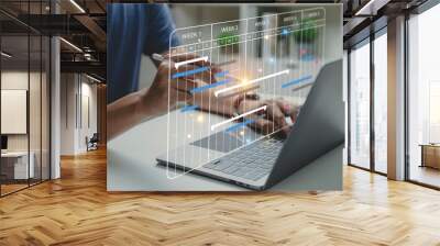 Project manager working with Gantt chart schedule to update the schedule, Management diagram with planning software on laptop screen. Wall mural