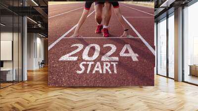 Young man ready to run preparing for 2024 goals. Wall mural