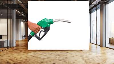 Hand holding gas nozzle with one last drop. A man holding a green gasoline nozzle on a white background. hands of men who were holding an automatic nozzle to make refill oil.  Wall mural