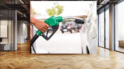 Man Refill and filling Oil Gas Fuel at station.Gas station - refueling. To fill the machine with fuel. Car fill with gasoline at a gas station. Gas station pump.  Wall mural