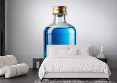 A transparent blue liquid fills this silver-capped, clear glass bottle to the brim, accompanied by a neatly wrapped Wall mural