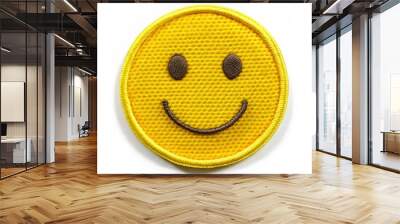 Bright yellow round smiley face embroidered badge with intricate stitching, isolated on a transparent background, perfect for creative designs and digital applications. Wall mural