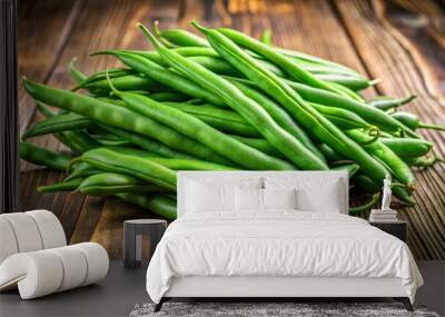 Fresh jack beans rest on a wooden surface, displaying their vibrant green hue and unique texture, inviting curiosity Wall mural