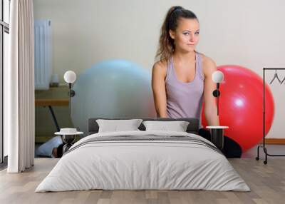 Girl with ball in gym Wall mural