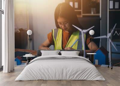 Female architect working at home She looked at the blueprint. Wall mural