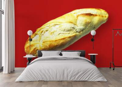 Fresh tasty bread French baguette on Red background.  Wall mural