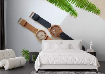 Brown and back wooden watches on white and soft brown color background Wall mural