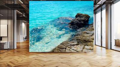 Rocks in the sea beautiful and clear blue sea with a rocky shore Wall mural