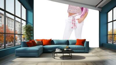 full length portrait of beautiful casual girl pointing and looki Wall mural