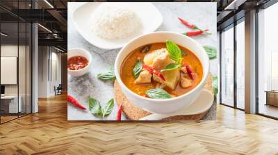 Thai traditional spicy curry with chicken and green pumpkin, Thai street food with streamed rice Wall mural