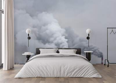 industrial chimneys with heavy smoke causing air pollution on the gray smoky sky background Wall mural