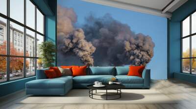 industrial chimneys with heavy smoke causing pollution on the blue sky background Wall mural