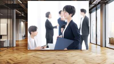 Image of a female businessman working in an office, profile Wall mural