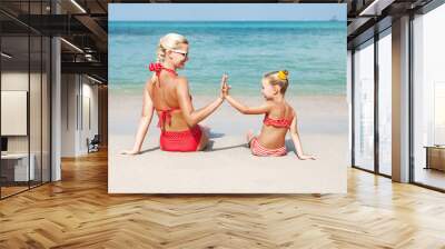 Happy family resting at beach in summer Wall mural