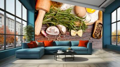 ingredients for homemade pasta on wooden table on brown backgrou Wall mural