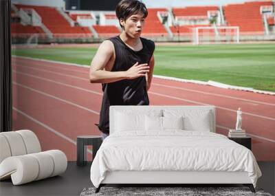 Young asian man exercise Wall mural