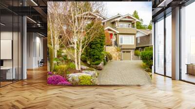 Two story stucco luxury house with nice spring blossom landscape in Vancouver, Canada Wall mural