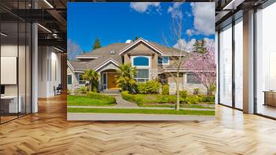 Two story stucco luxury house with nice spring blossom landscape in Vancouver, Canada Wall mural