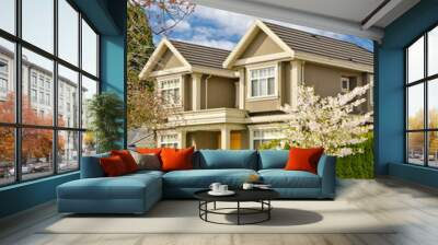 Two story stucco luxury house with nice spring blossom landscape in Vancouver, Canada Wall mural